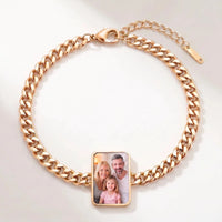 Thumbnail for Secret Cushion Photo Bracelet in gold, cushion-cut charm on a curb chain with the hidden photo revealed by warmth | SKU: TPH-CUSB-GOLD