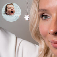 Thumbnail for Close-up of a woman wearing a Sun Photo Necklace by Brother & Sisters, showcasing a cherished baby photo.