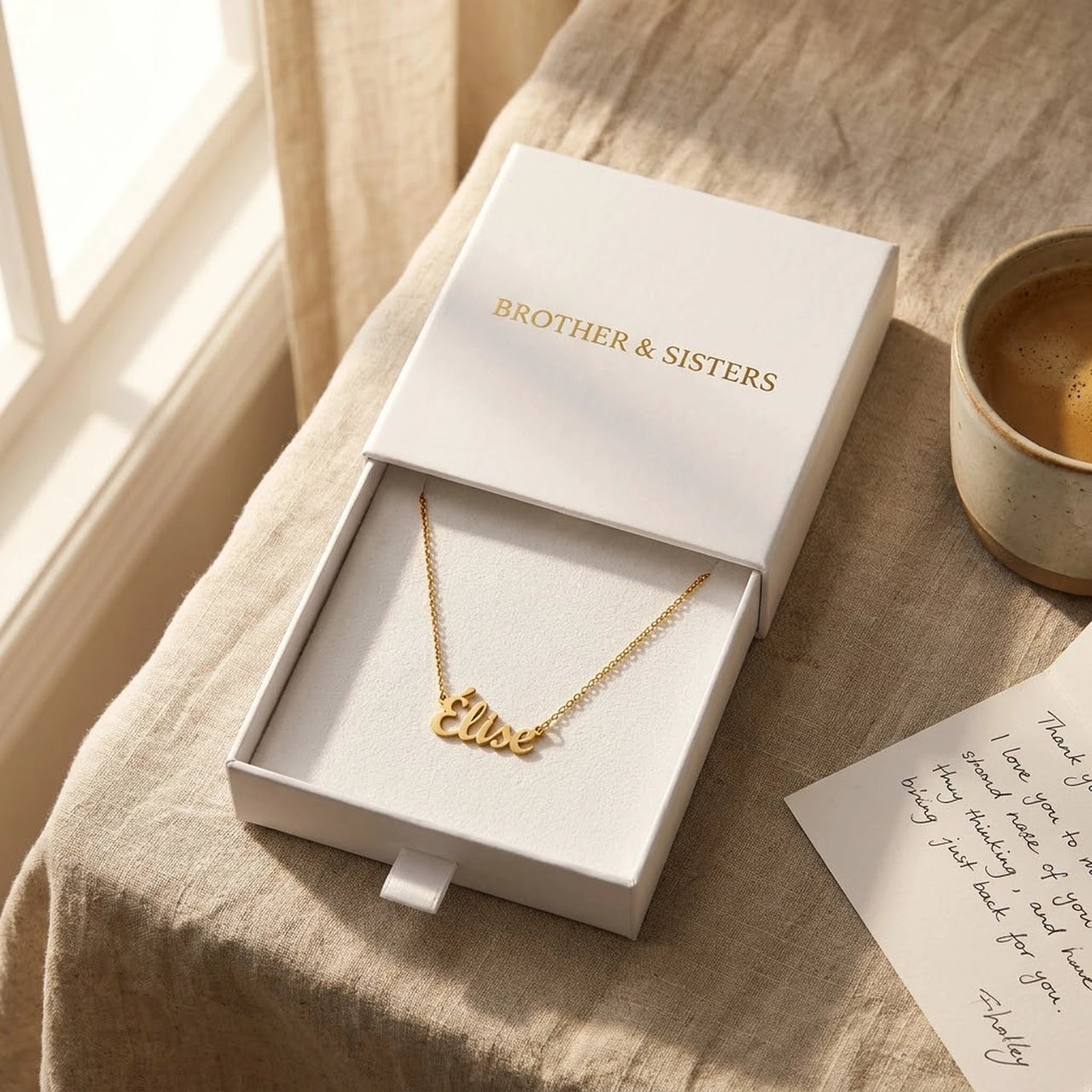 Minimalist Name Necklace in its Brother & Sisters gift box with a handwritten card, the name Elise | SKU: minimalistnn-gold