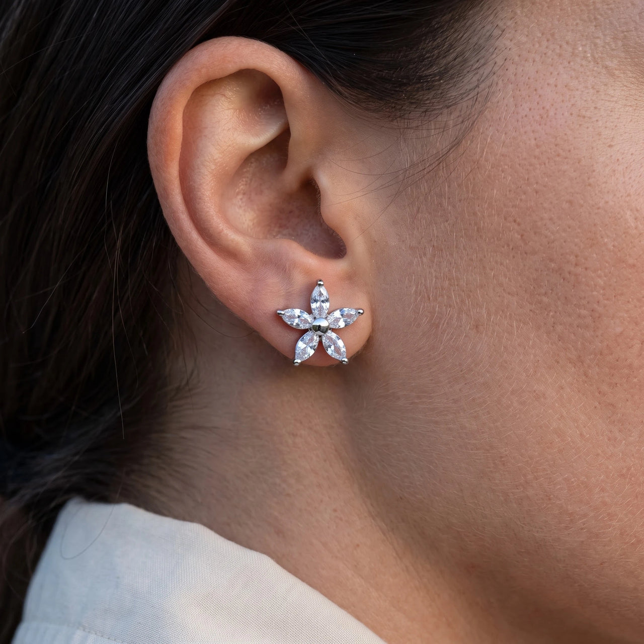 Close-up of the Austrian Crystals Flowers Earrings in silver worn | SKU: 419620-silver