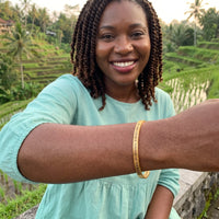 Thumbnail for Be The Unique Version Of Yourself bracelet in gold worn on a getaway | SKU: btuvoy-g