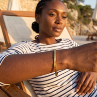 Thumbnail for Be The Unique Version Of Yourself bracelet in gold worn during a relaxed moment | SKU: btuvoy-g