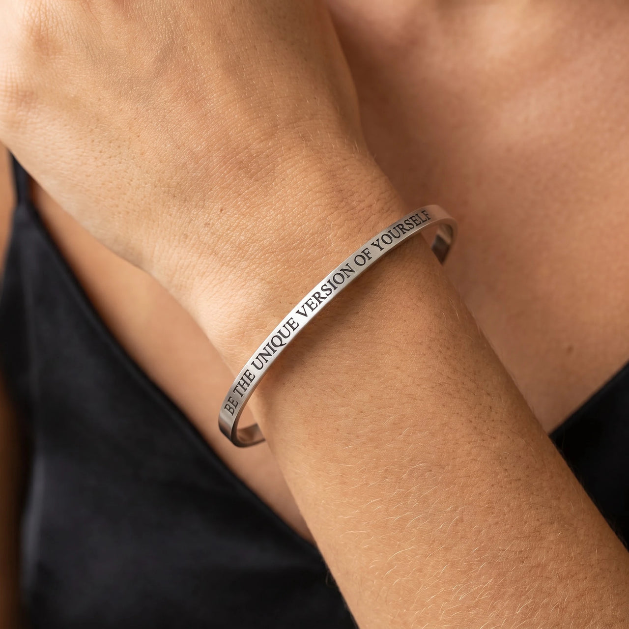 Close-up of the Be The Unique Version Of Yourself bracelet in silver worn | SKU: btuvoy-wg