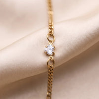 Thumbnail for Heart Bond Matching Bracelet Set in Gold — close-up of the heart crystal in its four-prong setting, held by two jump rings