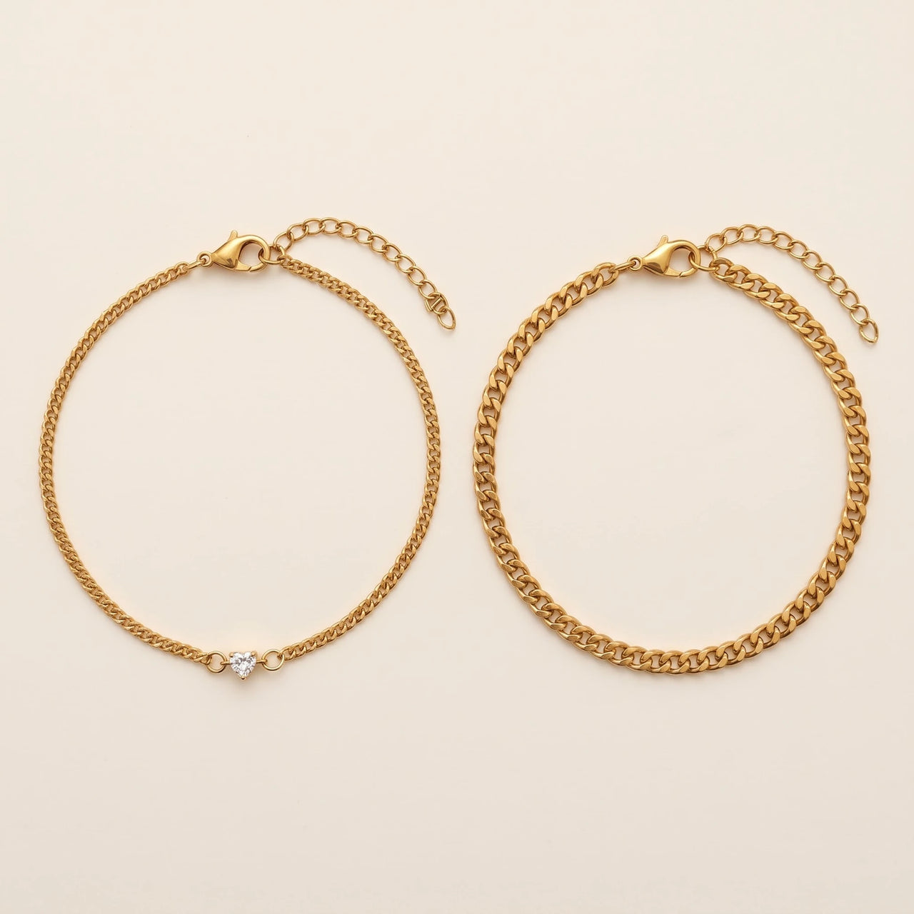 Heart Bond Matching Bracelet Set in Gold — his and hers bracelets side by side: fine curb chain with a tiny heart crystal for her, slim curb chain for him