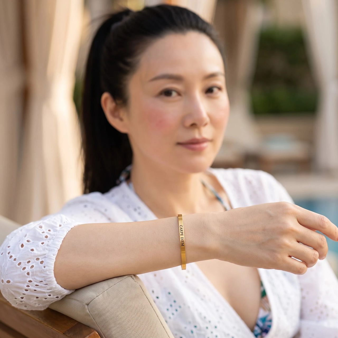 Carpe Diem bracelet in gold worn during a relaxed moment | SKU: cp-g