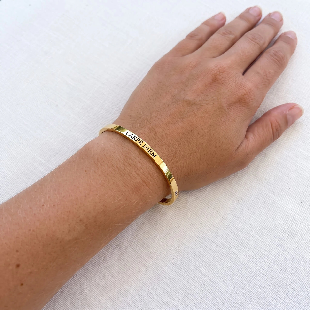 Carpe Diem bracelet in gold worn, showing its real size | SKU: cp-g