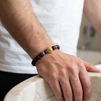 Thumbnail for Gold Lion & Black Stones Bracelet – close-up worn on a man's wrist | Brother & Sisters | SKU: 20712286-gold-XS-14-15, 20712286-gold-S-16-17, 20712286-gold-M-18-19, 20712286-gold-L-20-21, 20712286-gold-XL-22-23