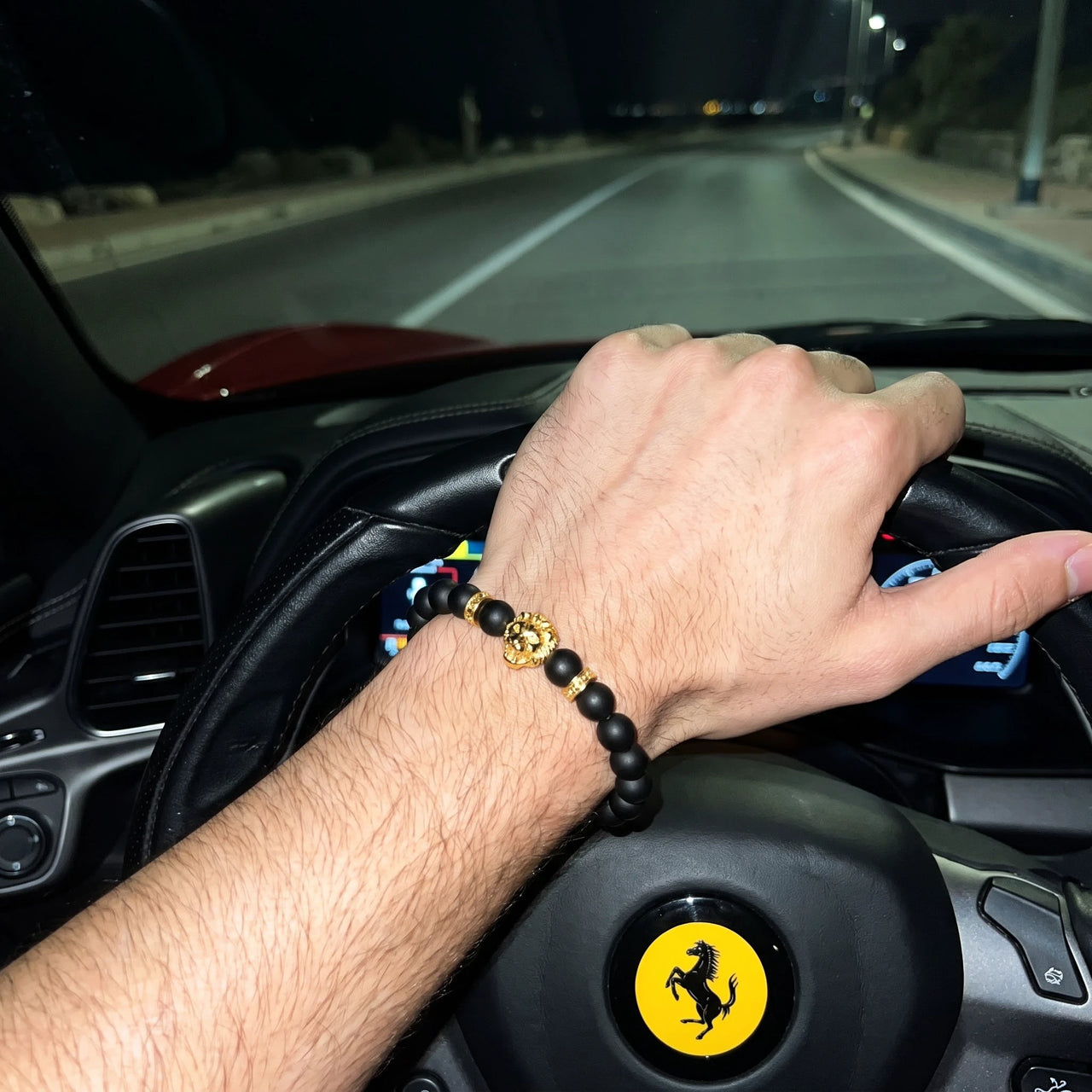 Gold Lion & Black Stones Bracelet – worn at the steering wheel of a luxury car | Brother & Sisters | SKU: 20712286-gold-XS-14-15, 20712286-gold-S-16-17, 20712286-gold-M-18-19, 20712286-gold-L-20-21, 20712286-gold-XL-22-23