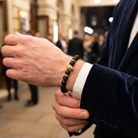 Thumbnail for Gold Lion & Black Stones Bracelet – worn with a shirt cuff | Brother & Sisters | SKU: 20712286-gold-XS-14-15, 20712286-gold-S-16-17, 20712286-gold-M-18-19, 20712286-gold-L-20-21, 20712286-gold-XL-22-23