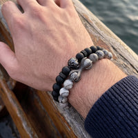 Thumbnail for Black Lion with Black & Grey Stones Set – close-up worn on a man's wrist | Brother & Sisters | SKU: 21369621-gun-black-XS-14-15, 21369621-gun-black-S-16-17, 21369621-gun-black-M-18-19, 21369621-gun-black-L-20-21, 21369621-gun-black-XL-22-23