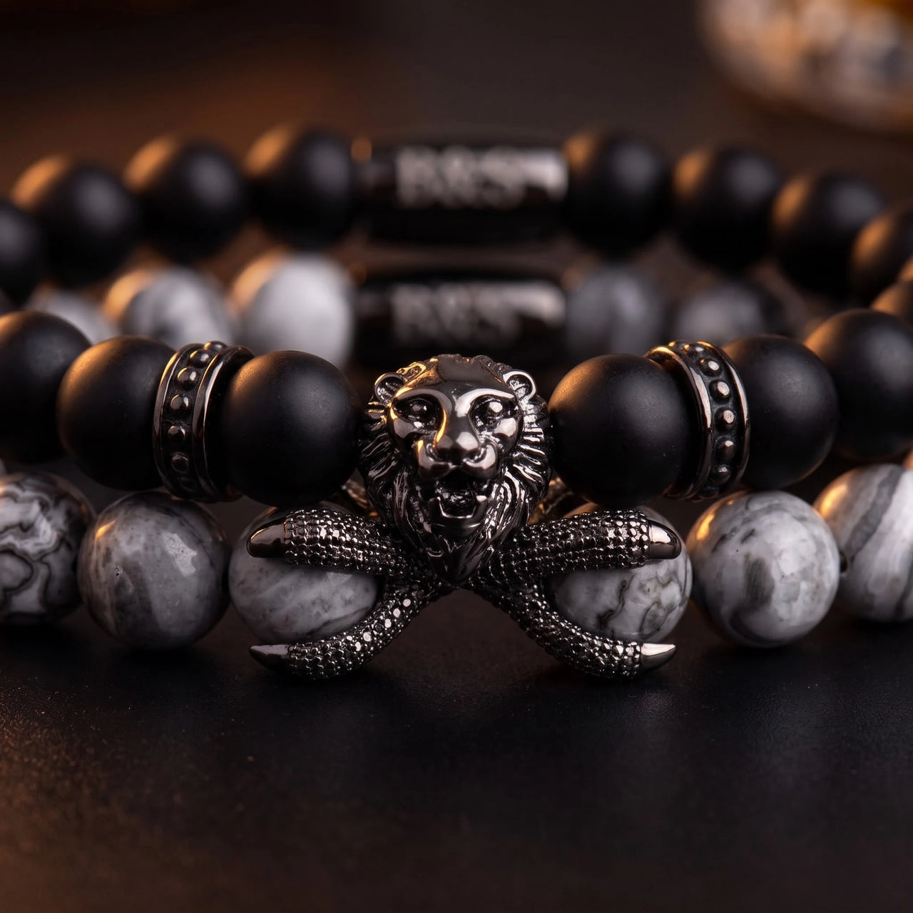 Black Lion with Black & Grey Stones Set – macro detail of the lion head | Brother & Sisters | SKU: 21369621-gun-black-XS-14-15, 21369621-gun-black-S-16-17, 21369621-gun-black-M-18-19, 21369621-gun-black-L-20-21, 21369621-gun-black-XL-22-23