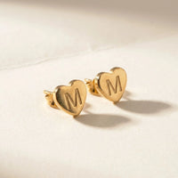 Thumbnail for Heart Initial Stud Earrings in Gold, studio packshot of the pair on a plain background | SKU: heart-initial-gold-a