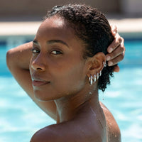 Thumbnail for Huggie Hoop Earrings Set of 4 Pairs in Silver worn in a swimming pool, waterproof 304L stainless steel | SKU: huggie-set-silver