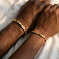 Thumbnail for Infinity Bond Matching Bracelet by Brother & Sisters featuring two name-engraved twisted bars in gold.