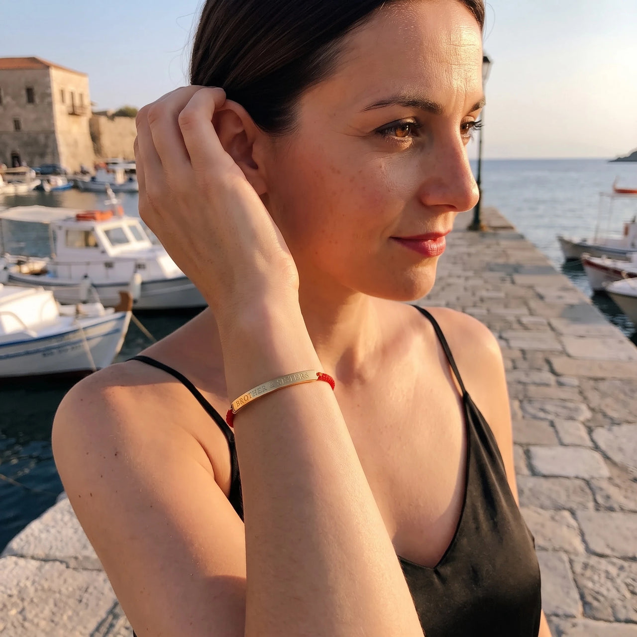 L'Amour, gold bracelet — worn gesture | SKU: lamour-g
