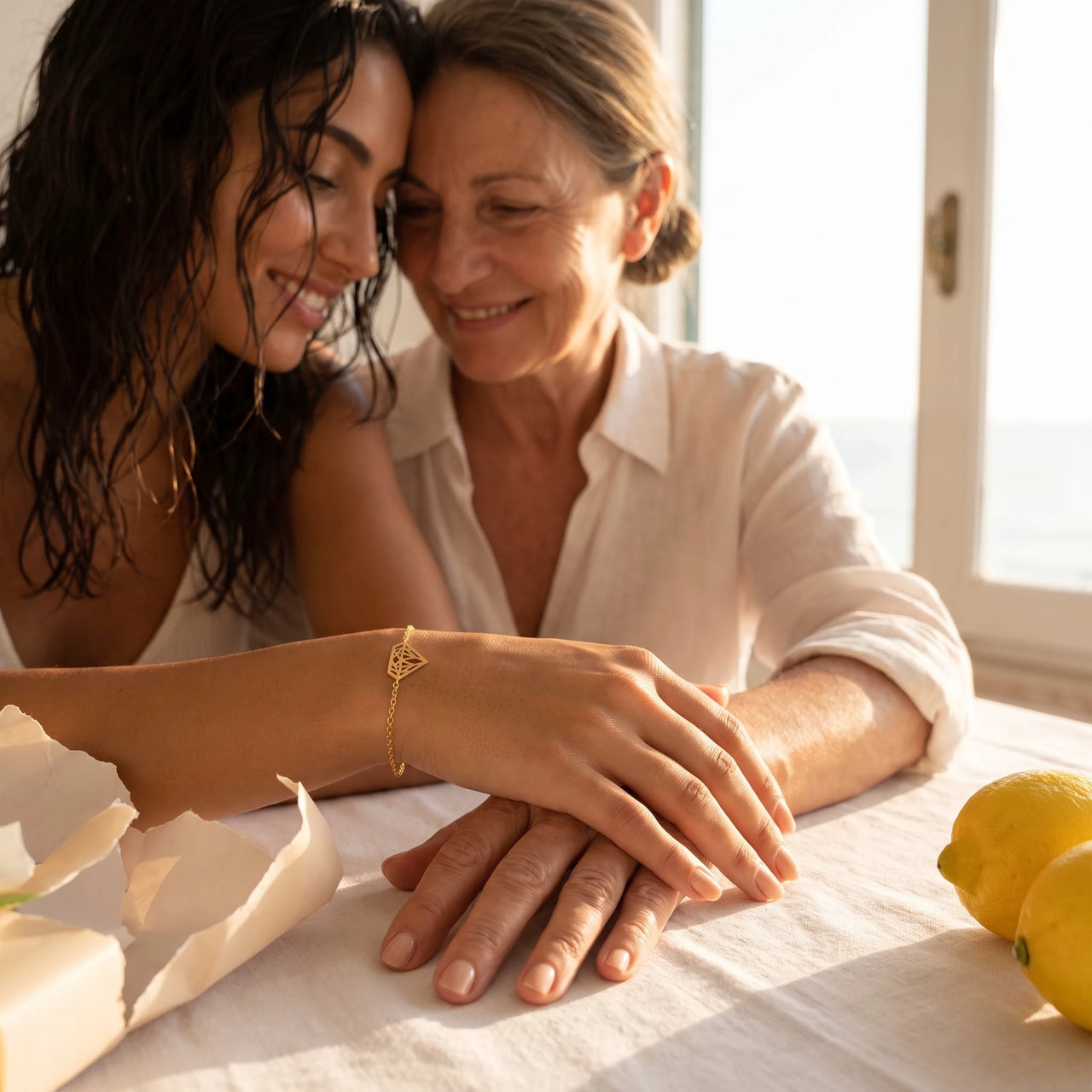 Gold bracelet offered as a gift between mother and daughter | SKU: 11662607-gold