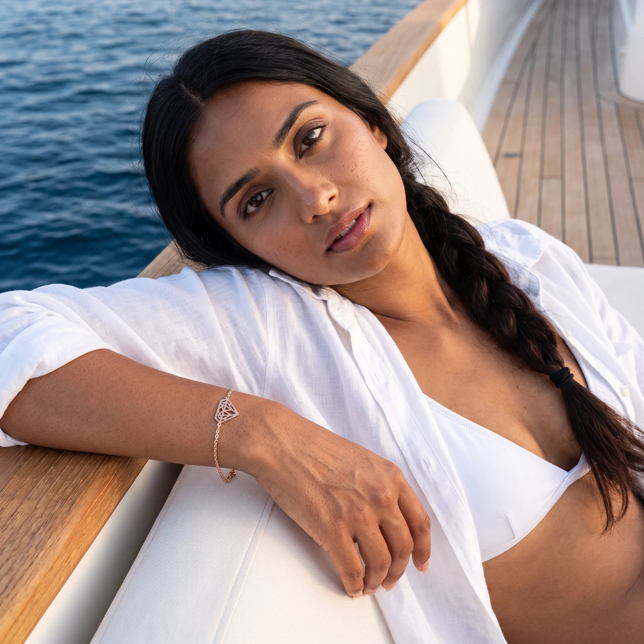 Woman on a yacht wearing the rose gold bracelet | SKU: 11662607-rose-gold