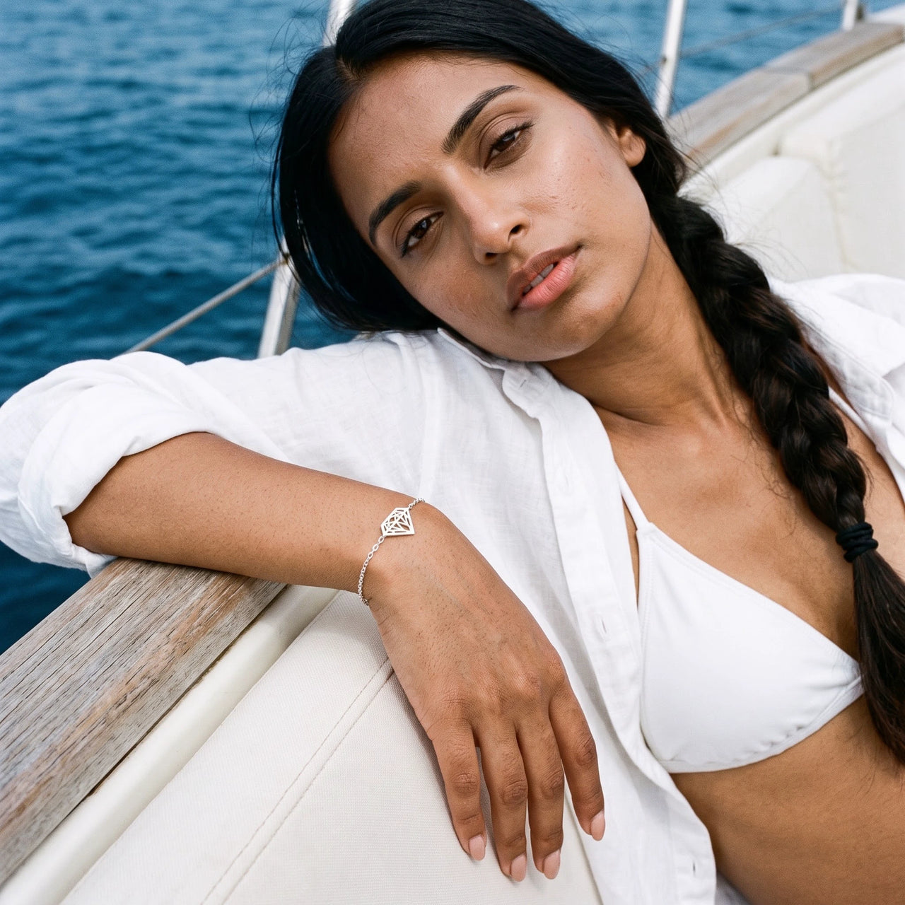 Woman on a yacht wearing the silver bracelet | SKU: 11662607-white-gold