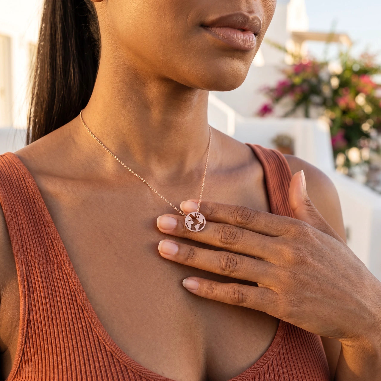 Woman gently touching her rose gold necklace | SKU: 22173453-rose-gold