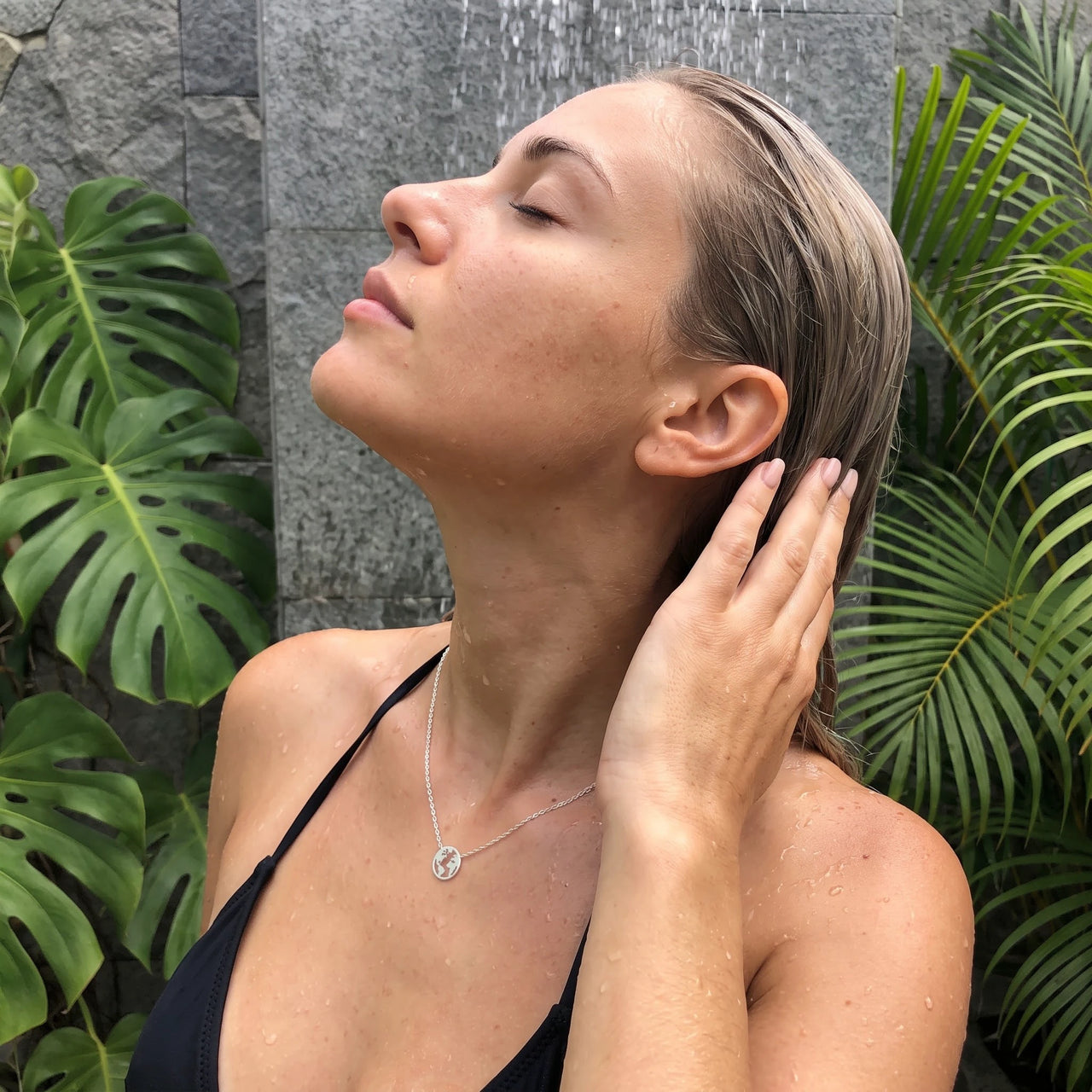 Silver necklace worn in a tropical outdoor shower | SKU: 22173453-white-gold