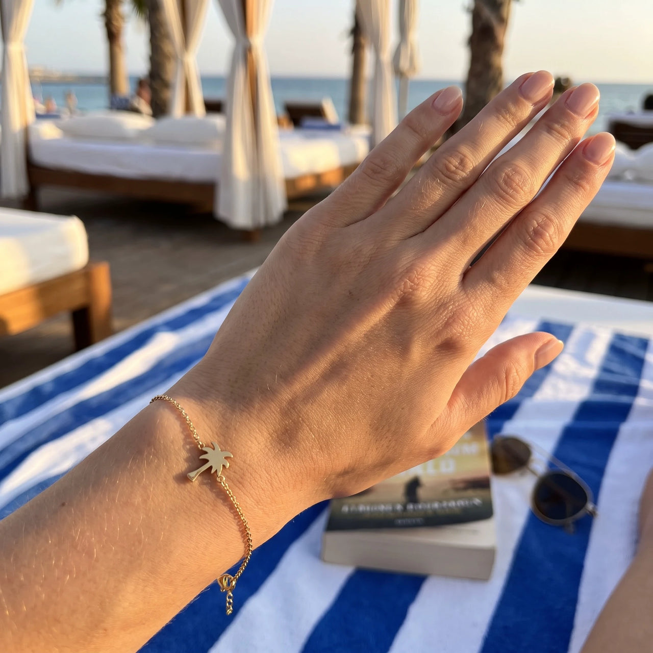 Gold charm bracelet worn, showing its real size | SKU: 7819407-gold-color