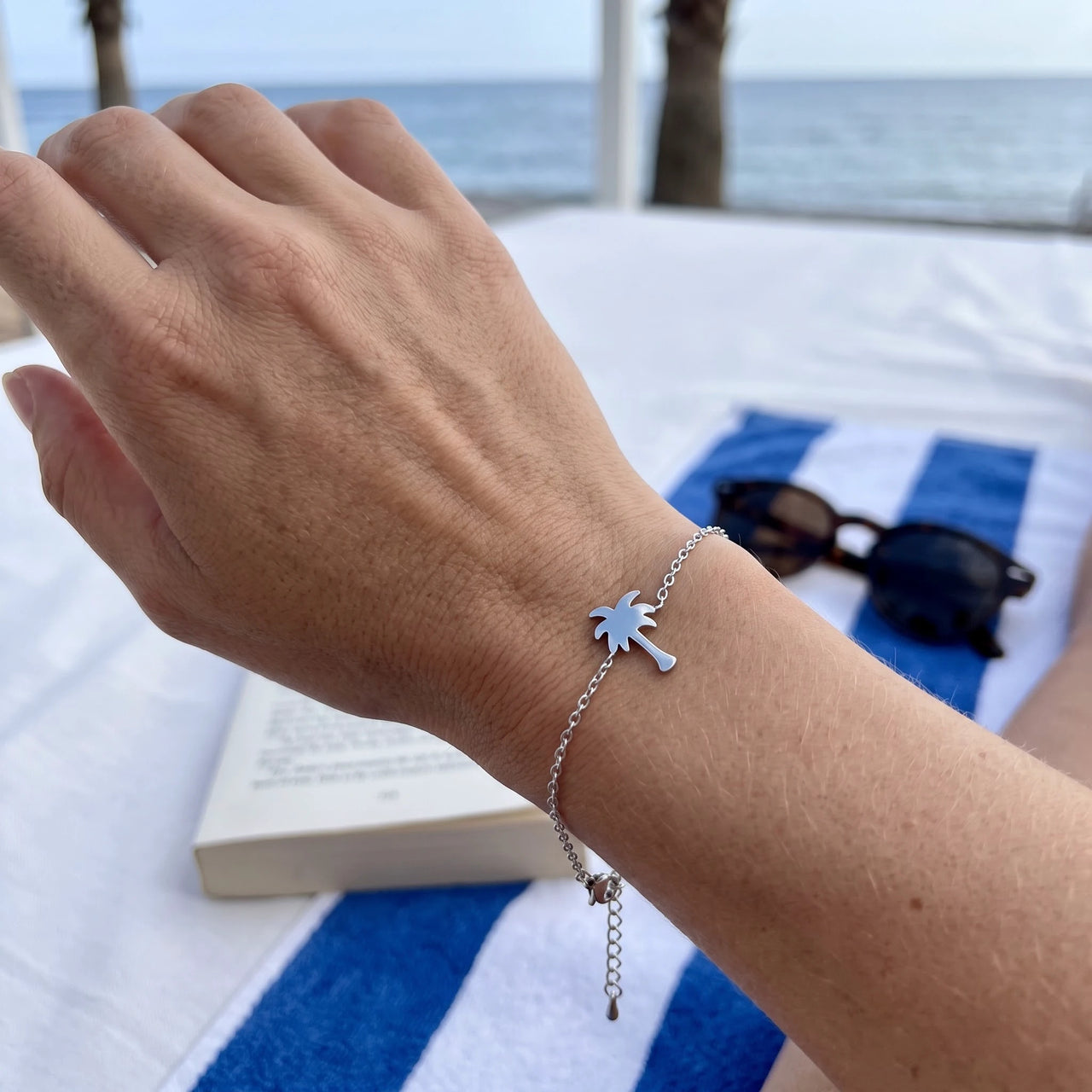 Silver charm bracelet worn, showing its real size | SKU: 7819407-silver-plated