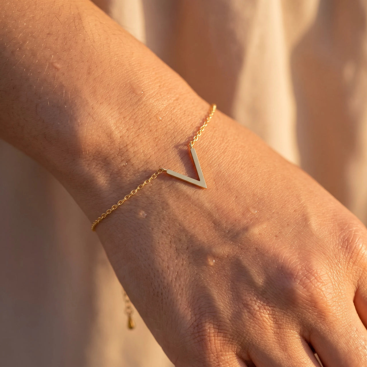 Close-up of the gold bracelet worn on the skin | SKU: 9443177-gold
