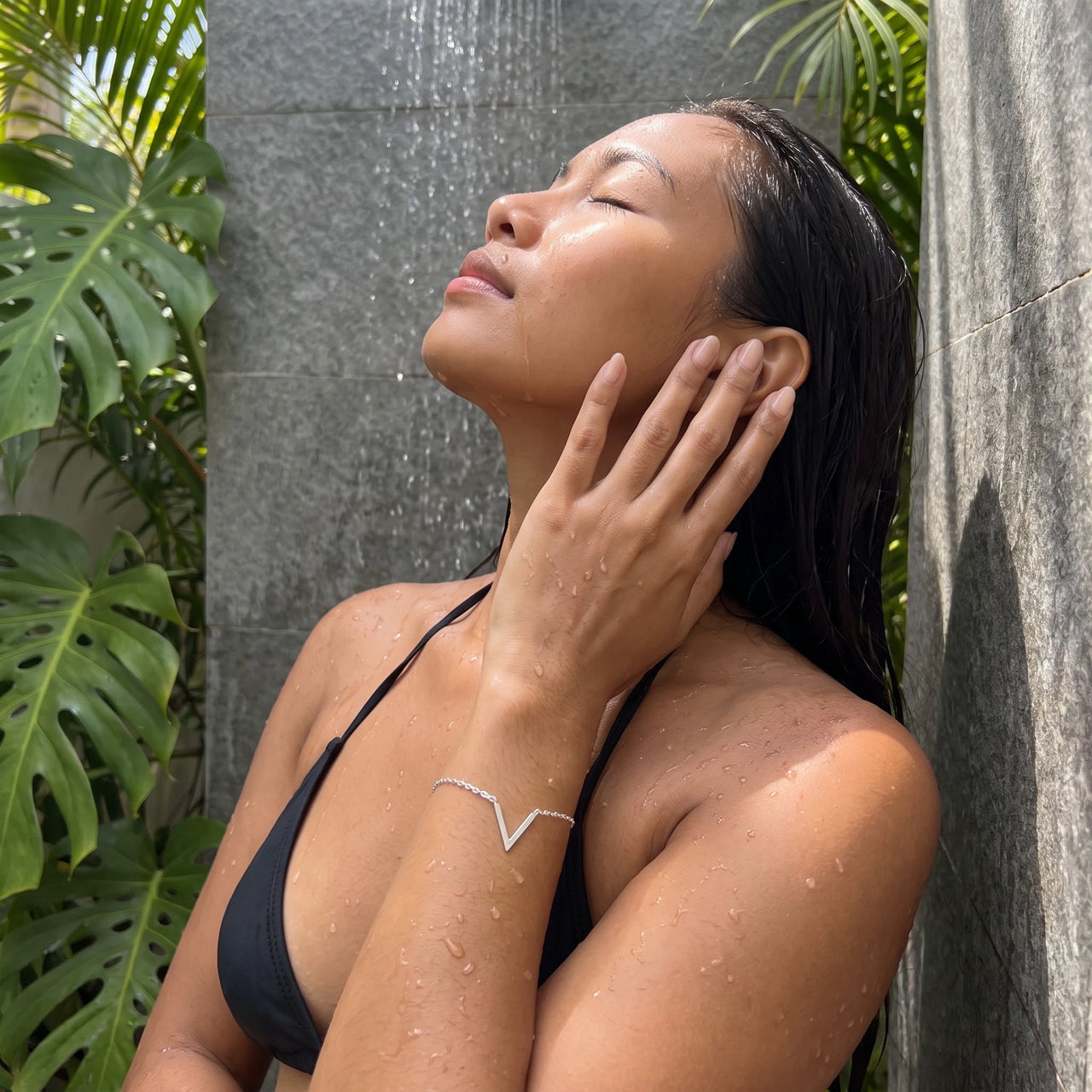 Silver bracelet worn in a tropical outdoor shower | SKU: 9443177-white-gold