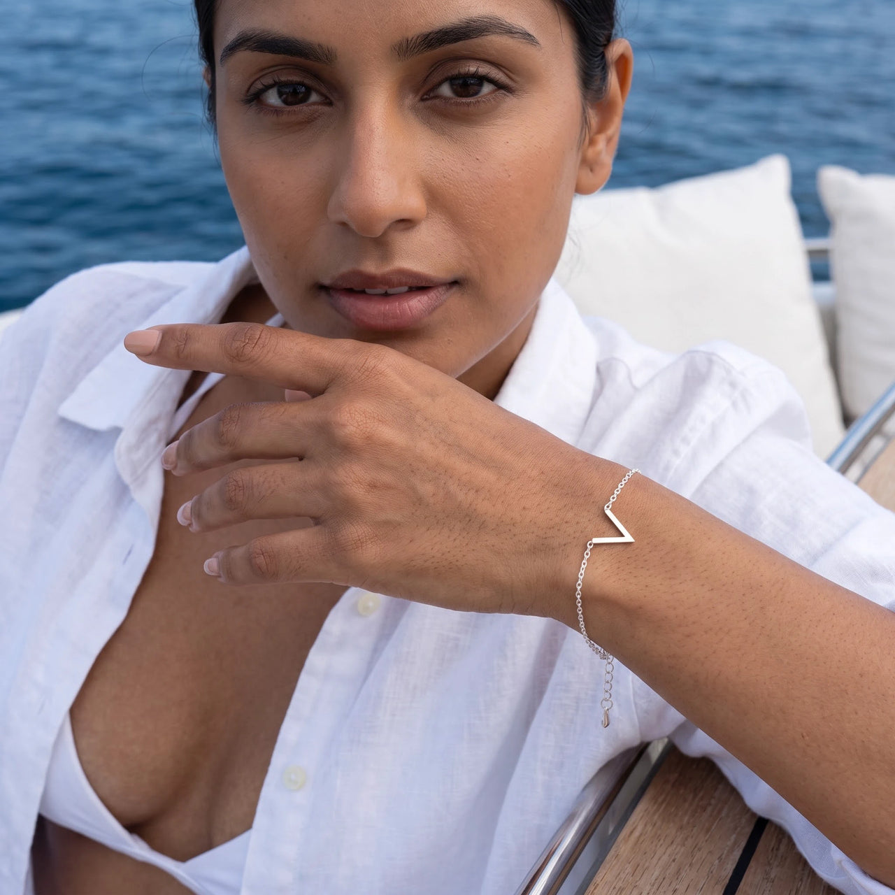 Woman on a yacht wearing the silver bracelet | SKU: 9443177-white-gold