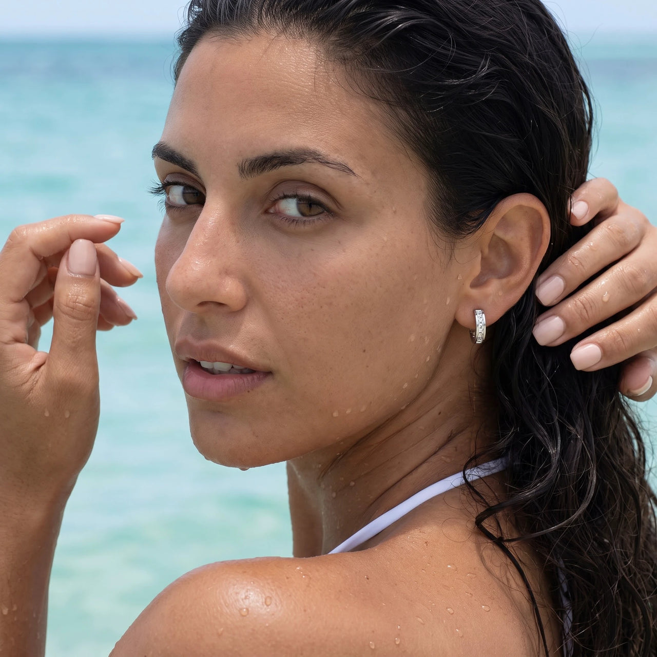 Silver huggie hoop earrings worn in the sea, waterproof stainless steel with water drops | SKU: 22023999-rhodium