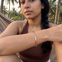 Thumbnail for Never Forget To Dream bracelet in rose gold worn during a relaxed moment | SKU: nftd-rg