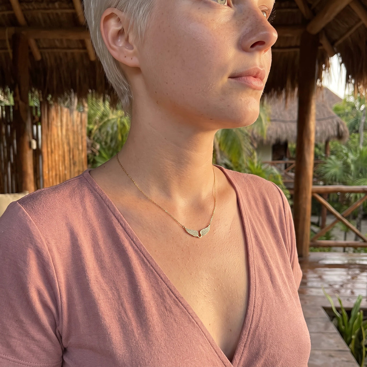 Profile view of a woman wearing the gold necklace | SKU: 42002-gold
