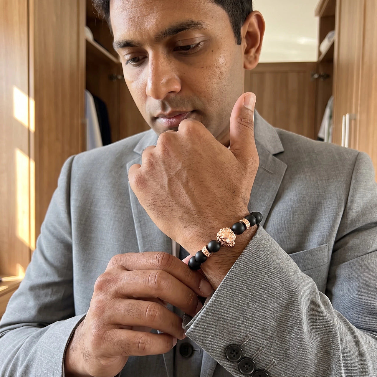 Rose Gold Lion & Black Stones Bracelet – worn with a shirt cuff | Brother & Sisters | SKU: 20712286-rose-gold-XS-14-15, 20712286-rose-gold-S-16-17, 20712286-rose-gold-M-18-19, 20712286-rose-gold-L-20-21, 20712286-rose-gold-XL-22-23