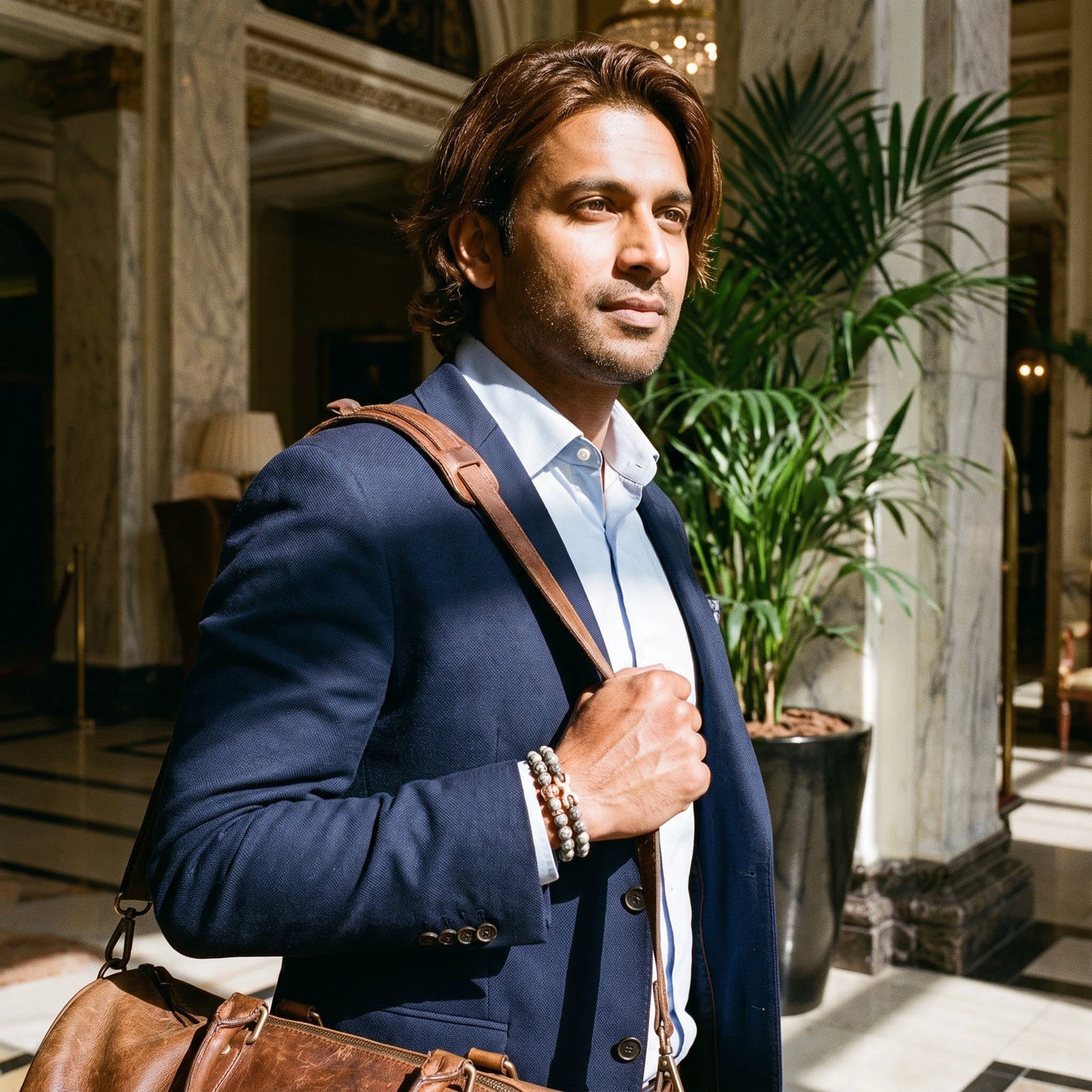 Rose Gold Lion & Grey Stones Set – worn while carrying a leather bag | Brother & Sisters | SKU: 21039839SET-rose-gold-XS-14-15, 21039839SET-rose-gold-S-16-17, 21039839SET-rose-gold-M-18-19, 21039839SET-rose-gold-L-20-21, 21039839SET-rose-gold-XL-22-23