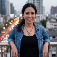 Thumbnail for Woman on a city rooftop wearing the black secret heart photo necklace | SKU: TPH-CHTN-BLACK-SMALL