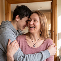Thumbnail for Mother hugging her son, wearing the black secret heart photo necklace | SKU: TPH-CHTN-BLACK-SMALL
