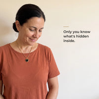 Thumbnail for Woman wearing the gold heart pendant, black on the outside, only she knows the photo inside | SKU: TPH-CHTN-GOLD-SMALL