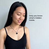 Thumbnail for Woman wearing the silver heart pendant, black on the outside, only she knows the photo inside | SKU: TPH-CHTN-SILVER-SMALL