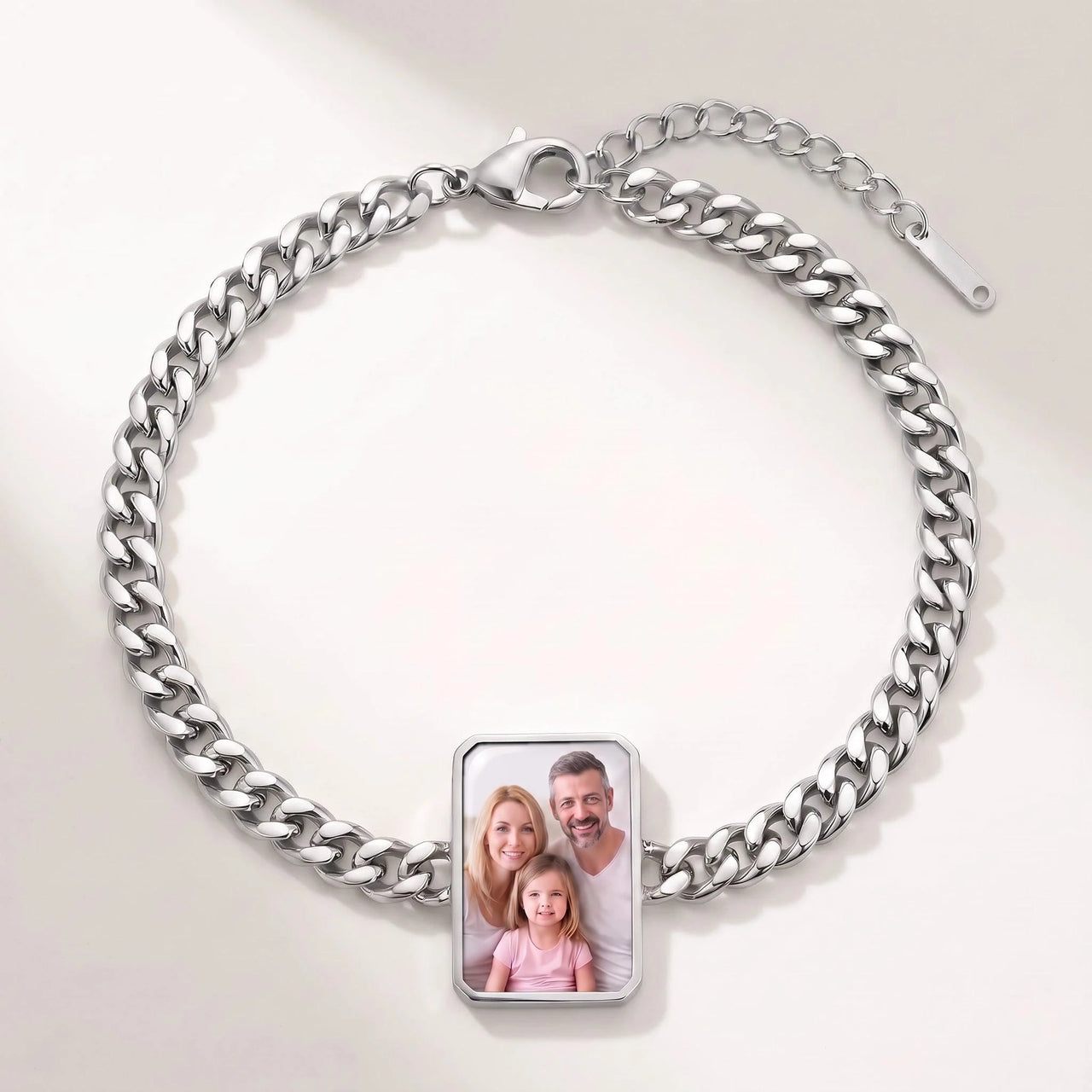 Secret Cushion Photo Bracelet in silver, cushion-cut charm on a curb chain showing a family photo revealed by warmth | SKU: TPH-CUSB-SILVER