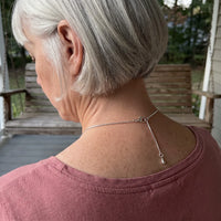 Thumbnail for Back of the neck of a grey-haired woman showing the clasp and extension chain of the silver drop photo necklace | SKU: TPH-DRPN-SILVER