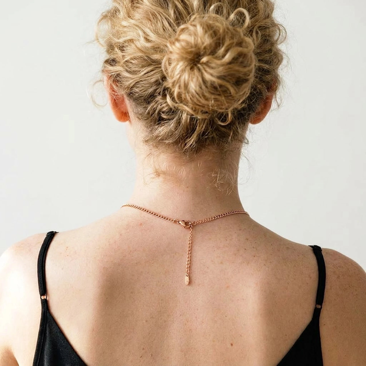 Back of the neck showing the lobster clasp and extension chain of the rose gold photo necklace | SKU: TPH-HRTN-ROSEGOLD