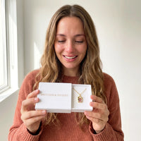 Thumbnail for The gold oval photo necklace with her grandmother's photo in the Brother & Sisters gift box | SKU: TPH-OVLN-GOLD