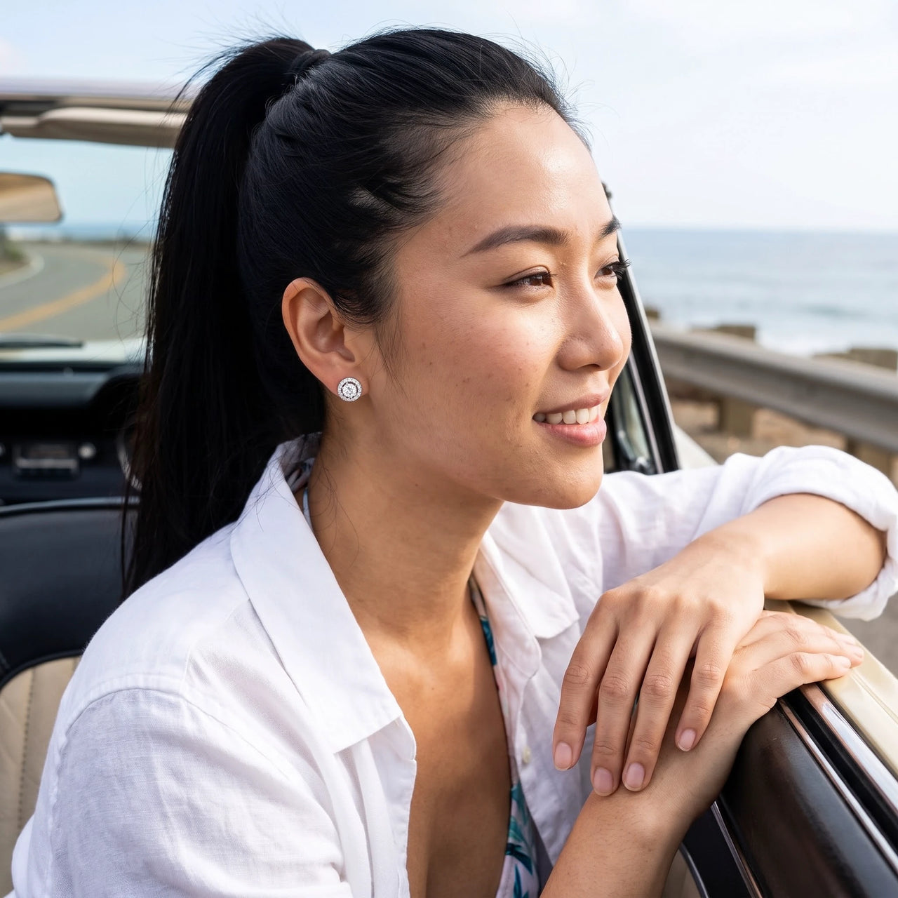 Woman relaxing on holiday wearing the silver stud earrings | SKU: 19991927