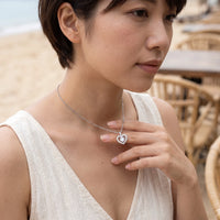 Thumbnail for Woman gently touching her silver necklace | SKU: 505744