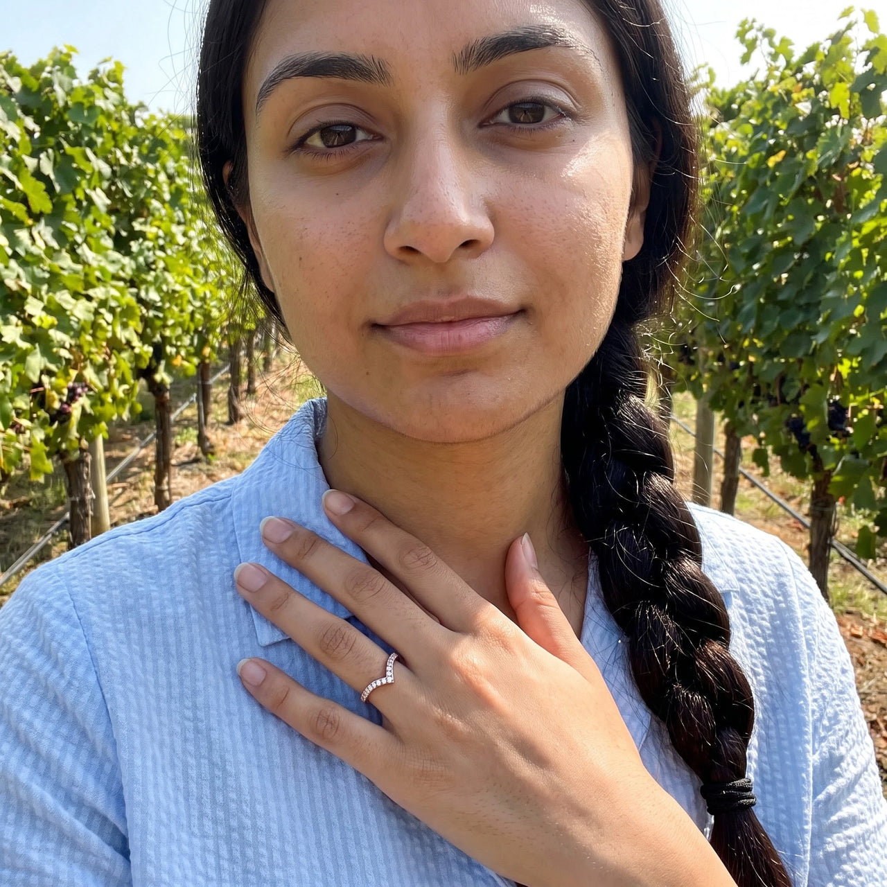 Woman gently touching her Rose Gold Minimalist Ring | SKU: 10645547-4.5-rose-gold