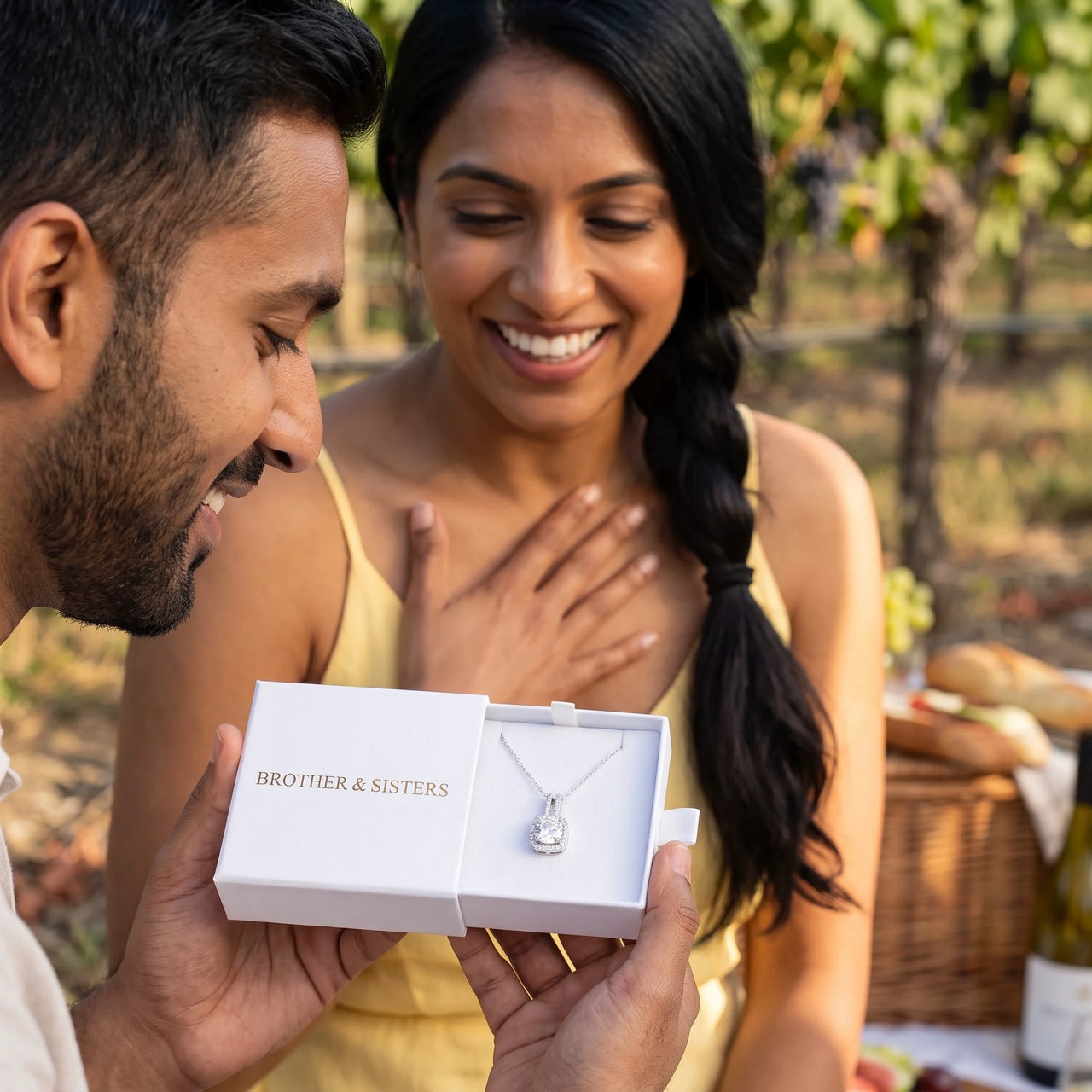 He surprises her with the silver necklace in its gift box | SKU: 505762