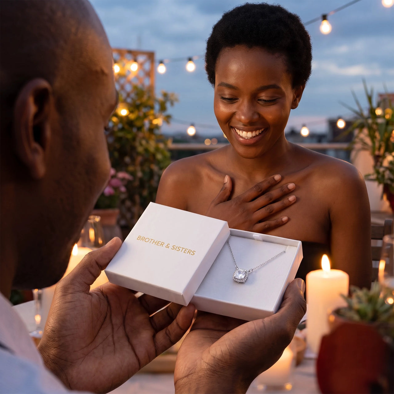 He surprises her with the silver necklace in its gift box | SKU: 505721